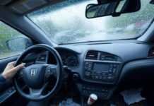 Top First Cars for Young Drivers in 2025: Features, Prices, and Safety Tips Blurry first-person view of my 2025 Honda Civic dashboard during a panic-brake moment, rain blurring the windshield.